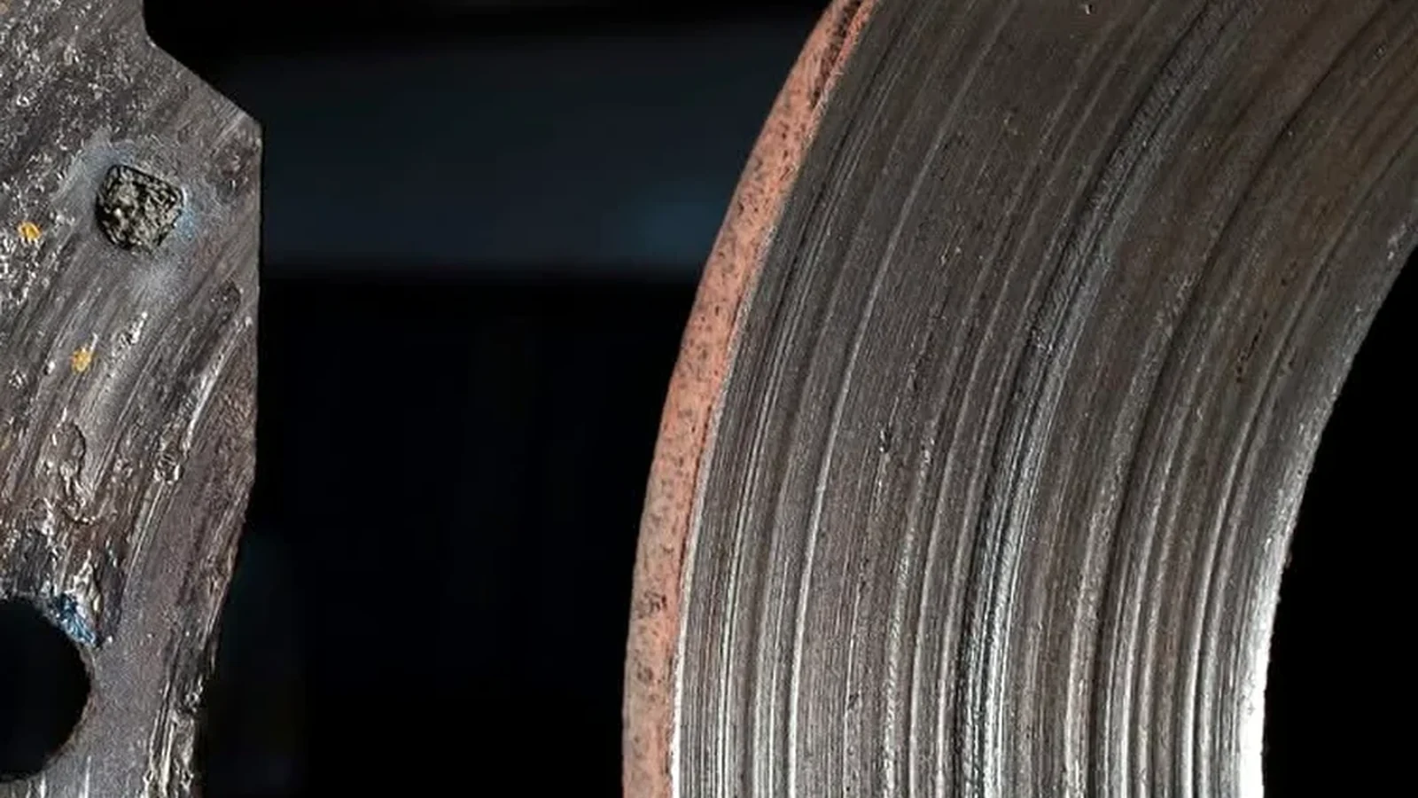 Close view of brake rotor wear during a brake inspection