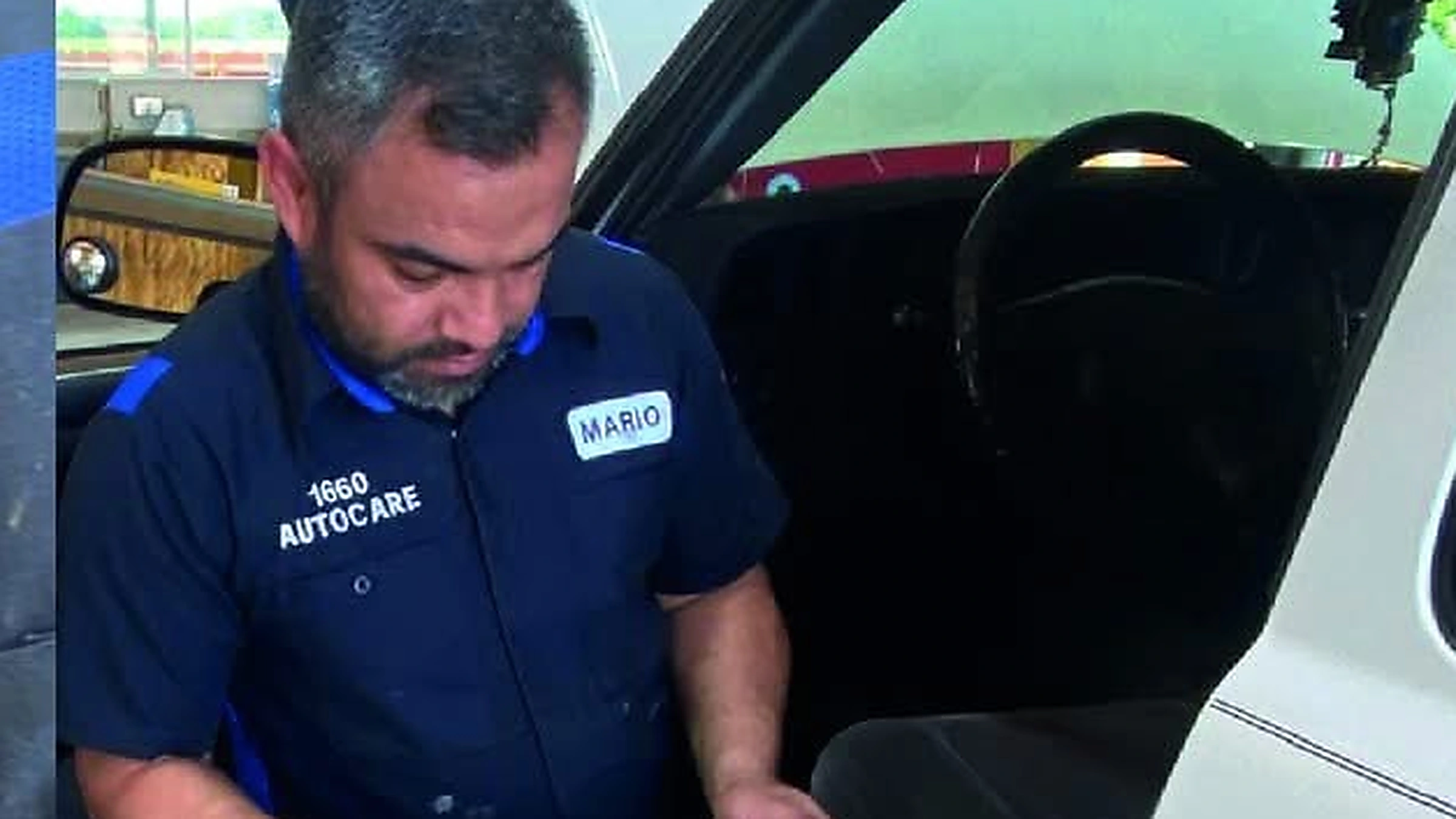 Technician using a scan tool during automotive diagnostic testing