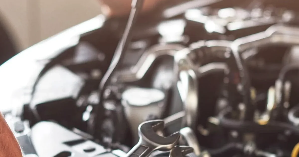 1660 Autocare technician working under the hood