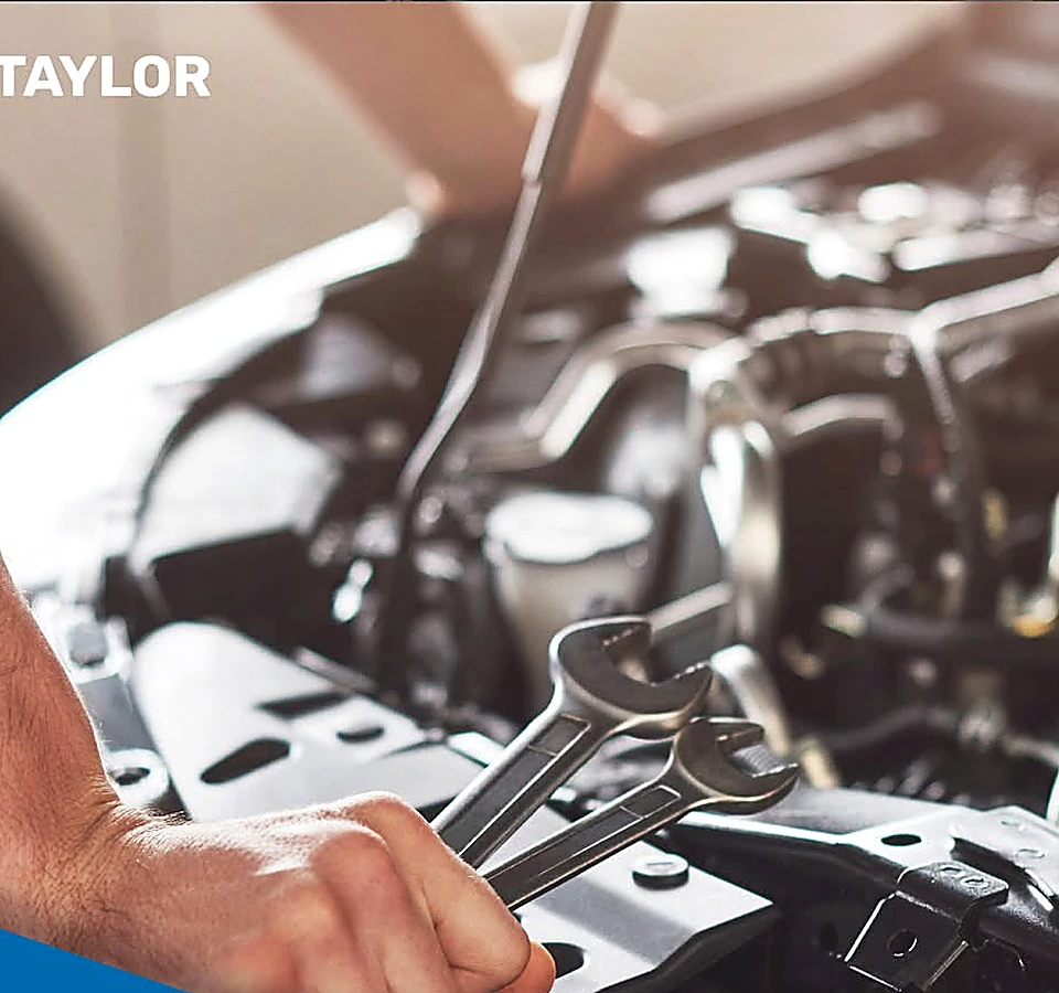 Hands and tools during an under-hood repair at 1660 Autocare