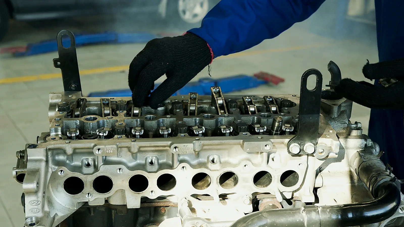 Technician inspecting engine components during repair