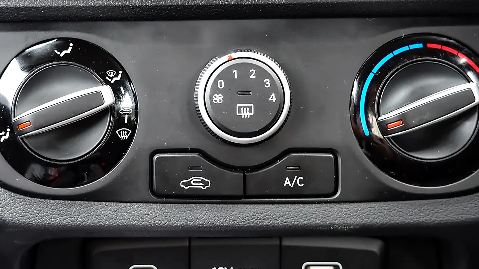 Close view of automotive air-conditioning and dashboard controls